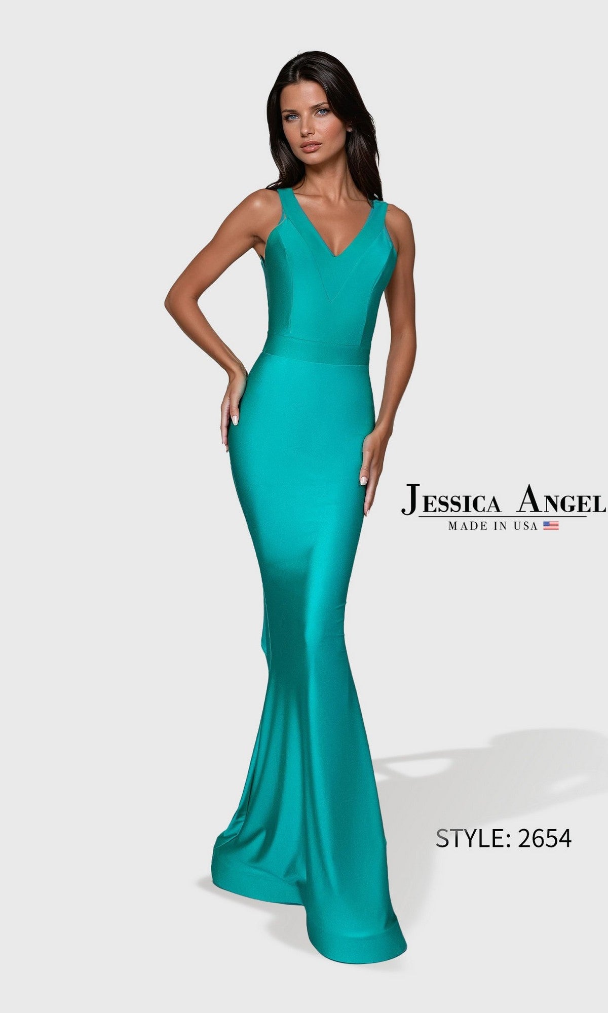 A woman wears the Long Prom Dress: Jessica Angel 2654 in seafoam, a fitted sleeveless gown with a V-neckline, stretch jersey fabric, and a flared hem.